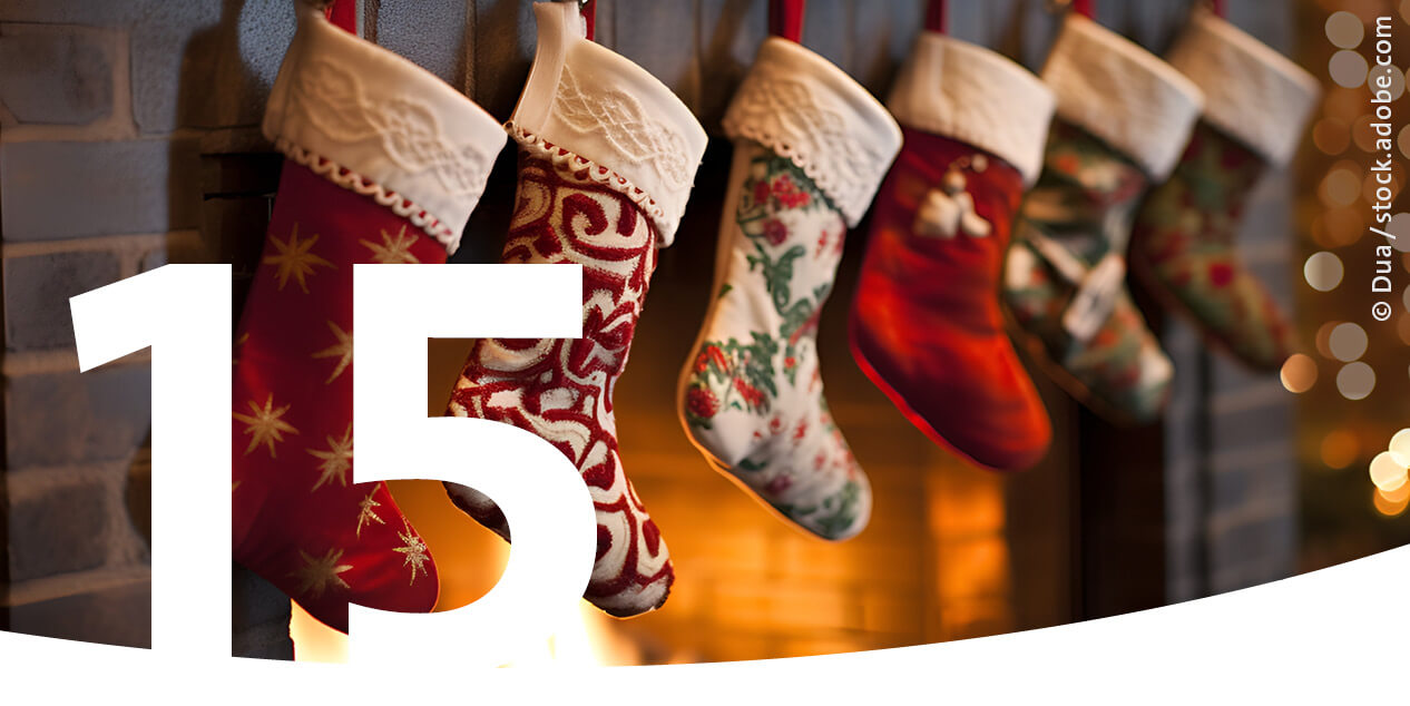 Christmas stockings hanging by the fireplace as the image for December 15th in the advent calendar.