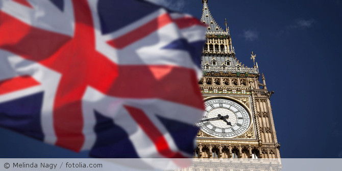 Big Ben with an England flag in the foreground.