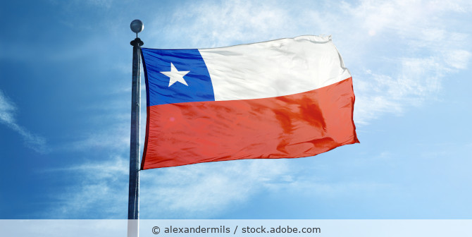 Chile's flag in front of blue sky.
