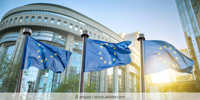 European flags waving in front of the EU Parliament in Brussels.