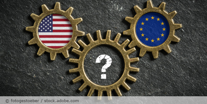 Gears with the EU and USA flags and a question mark.