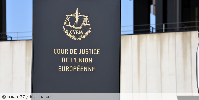 A sign with the emblem of the Court of Justice of the European Union.