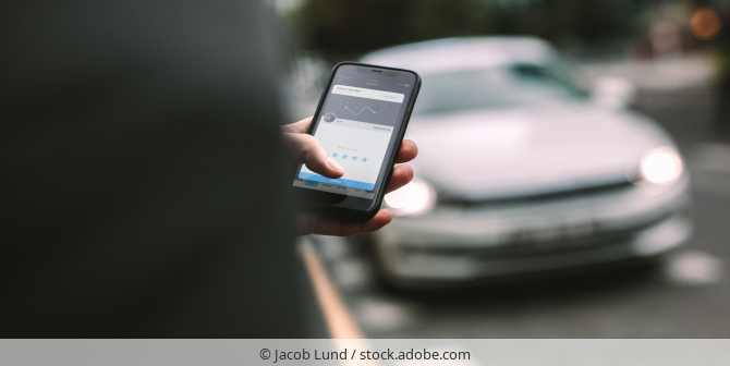 A person ordering a ride via an app.