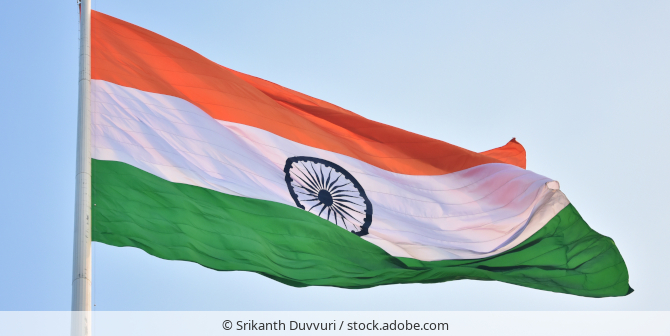 The flag of India flying on a flagpole.