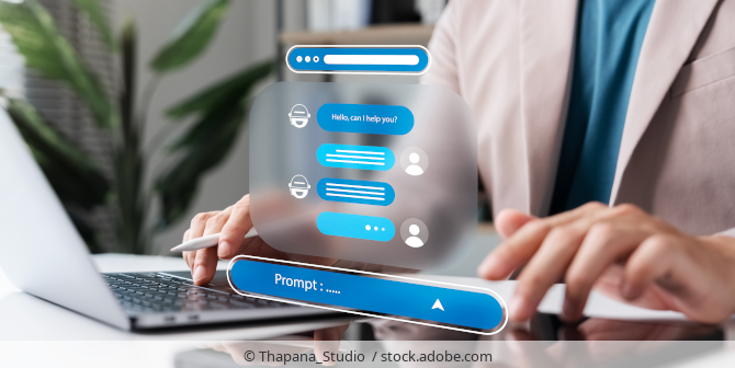 Employee using a chat bot working on a laptop in their office.