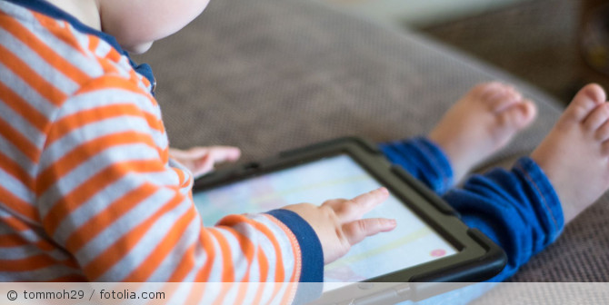 A child at a tablet.