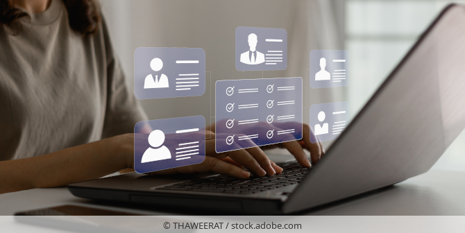 Person viewing data profiles on their laptop.